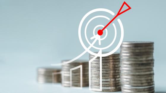 Target in front of stacks of coins