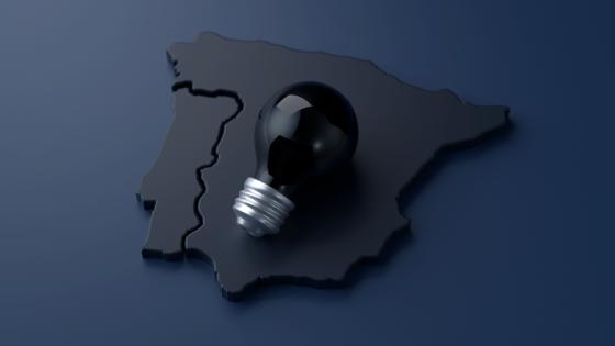 Black lightbulb on 3D rendering of Iberian Peninsula