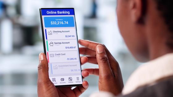 Woman checking savings balance on phone