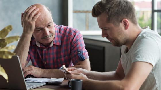 Father and son discussing money