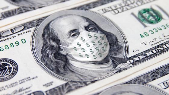Benjamin Franklin with face medical mask with dollar sign on 100 dollar bill