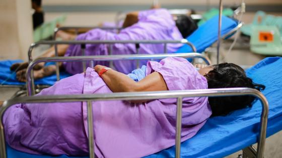 Patients on hospital beds waiting to see doctor