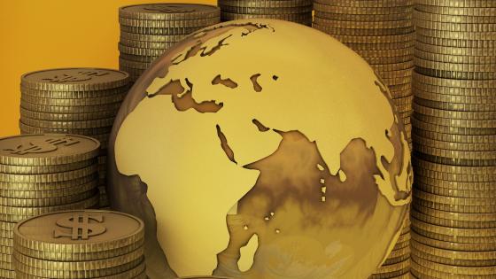 Globe and piles of coins