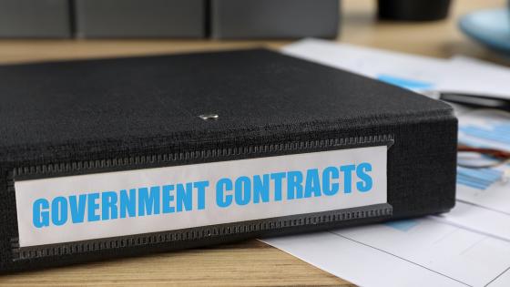 folder with Government Contracts label on desk