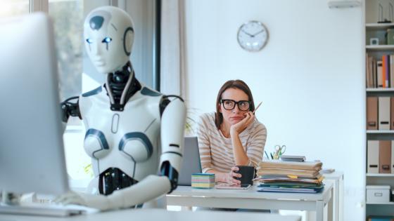 stressed woman and AI robot in the office