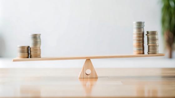 Balancing Money on a Seesaw